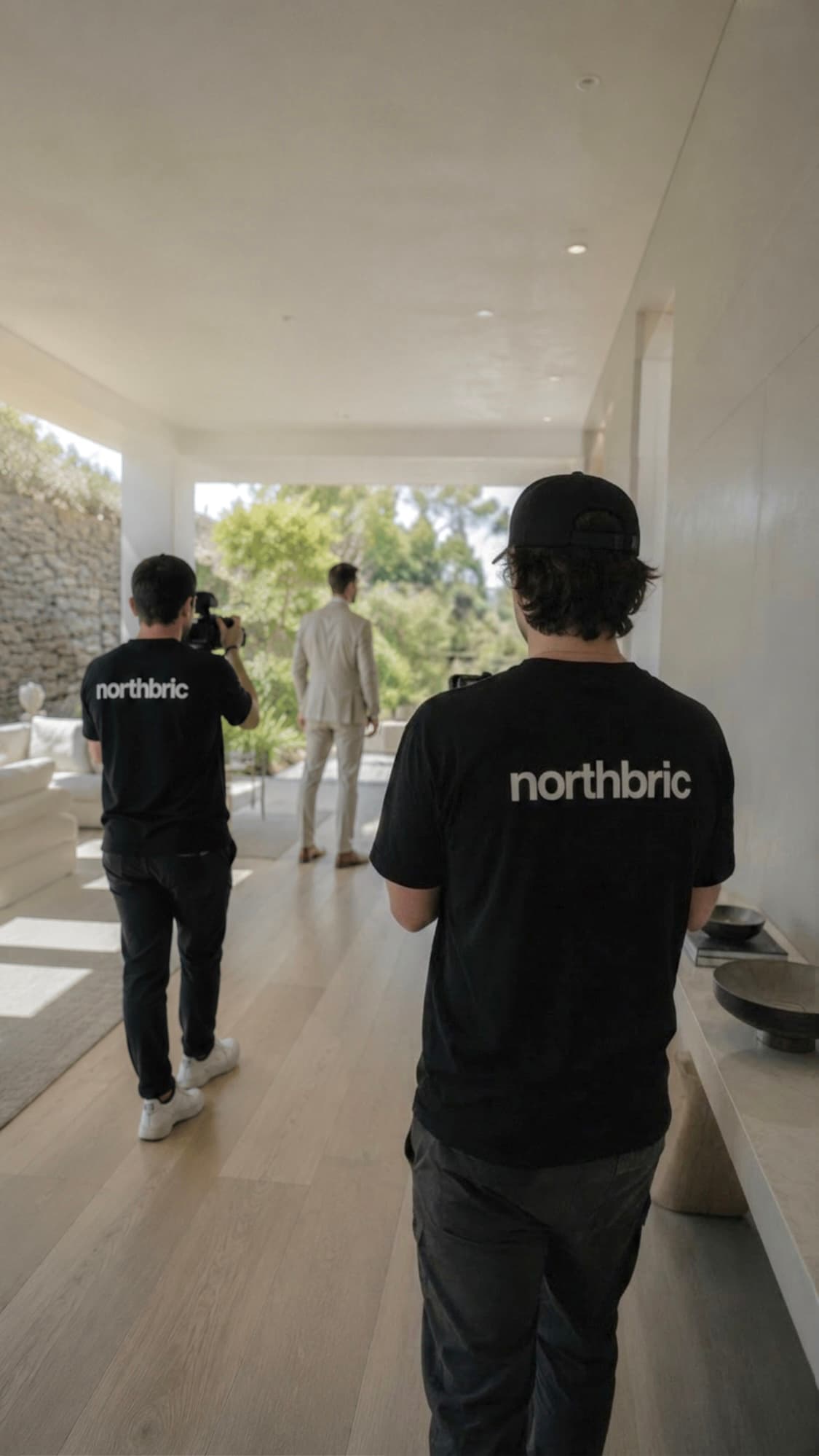 The NorthBric crew filming an agent on location inside a modern home